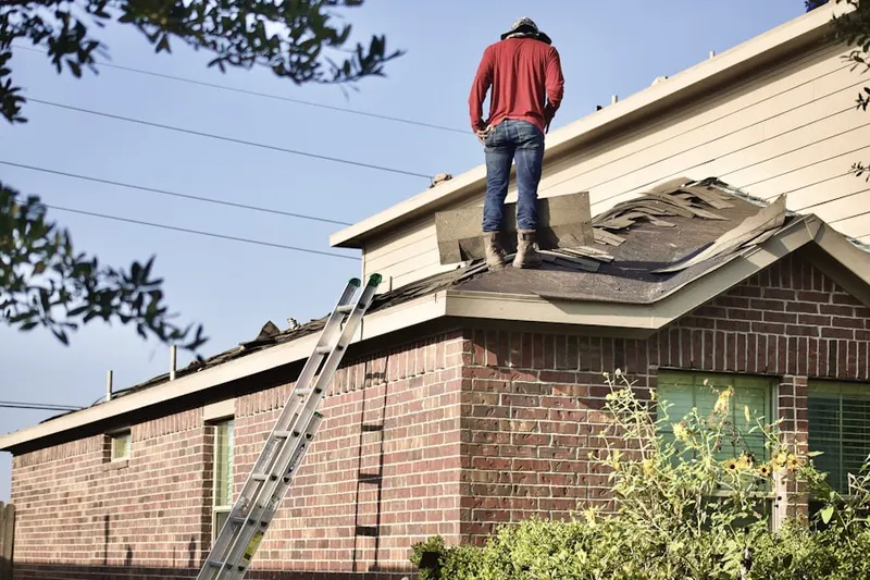 Professional roofer working on a residential roof in Heritage Oaks